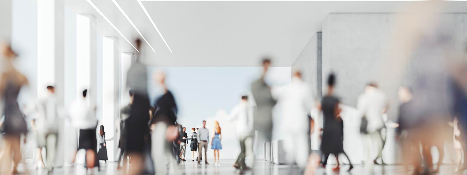 Image of group of people walking in building