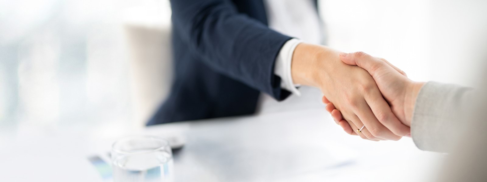 Image of two people shaking hands