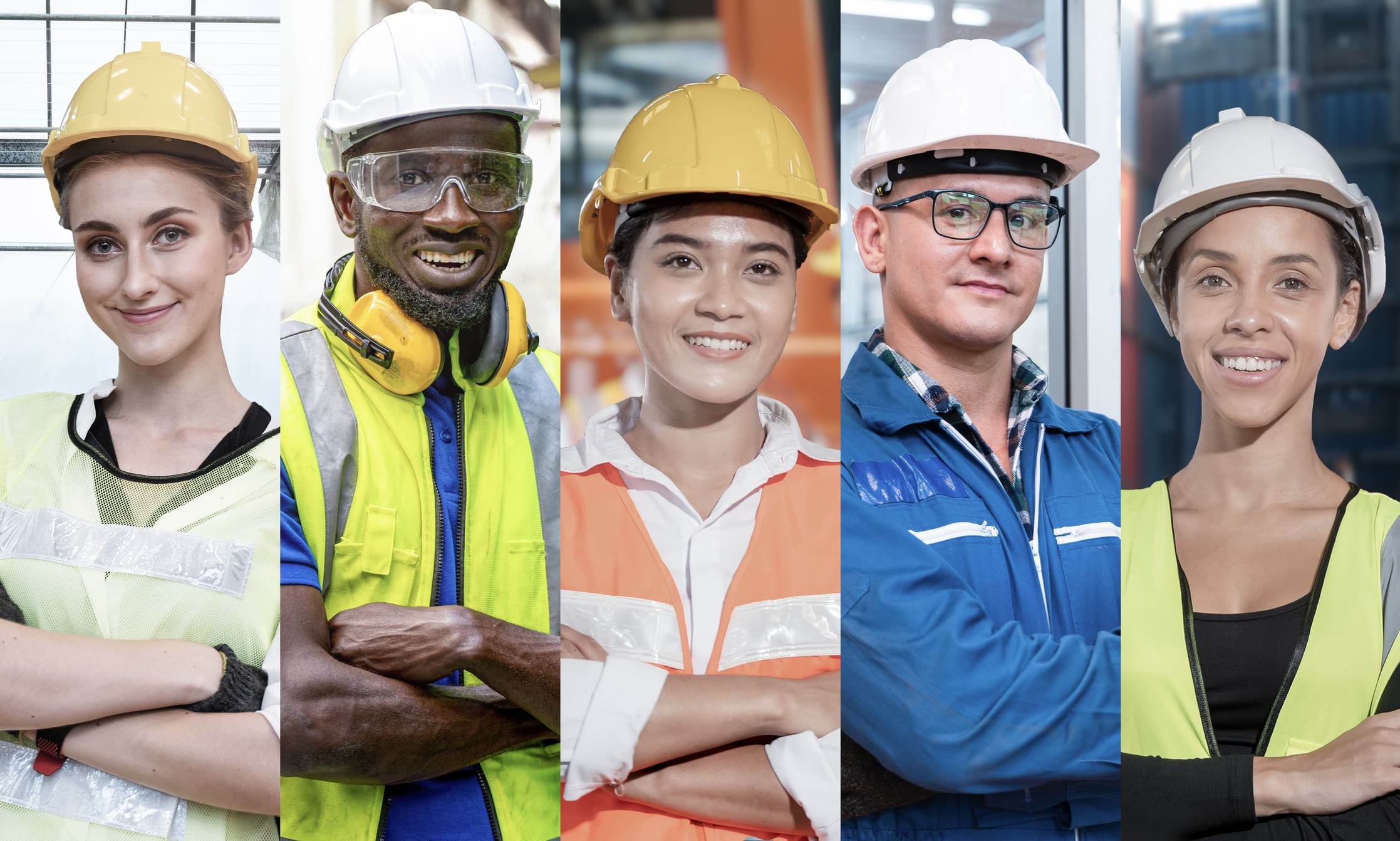 Five manual workers dressed in construction hats and high vis clothing - two men and three women